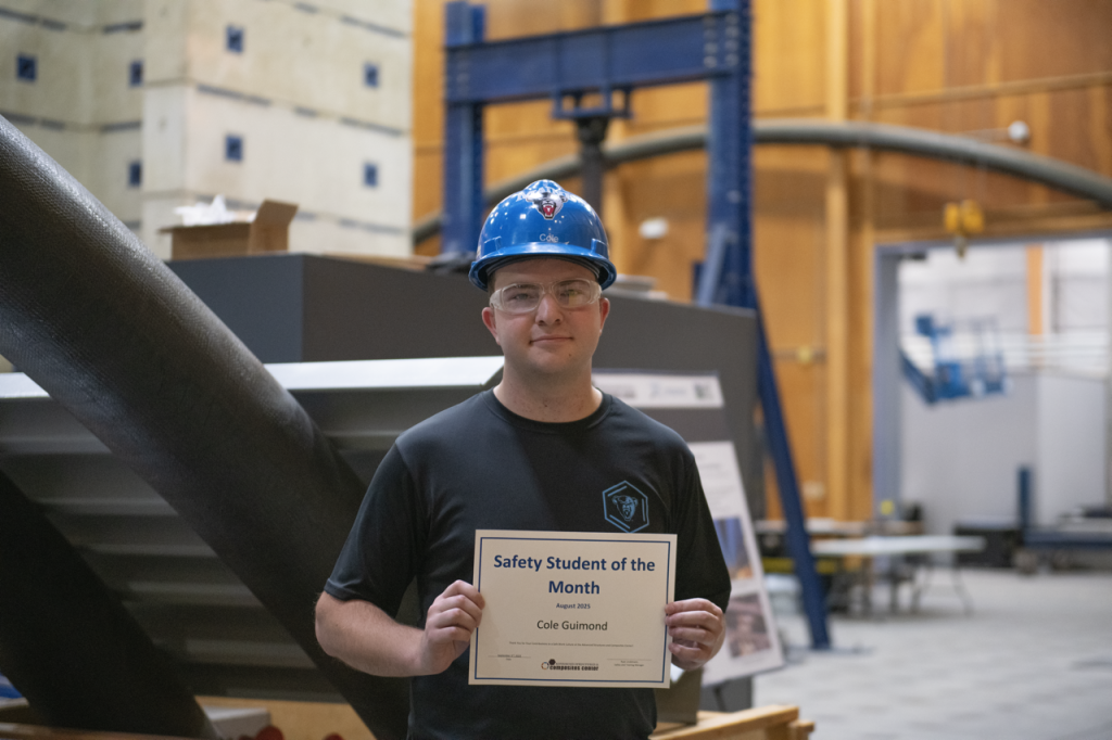 Cole Guimond holding up Safety Student of the Month certificate